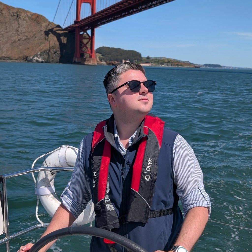 Joe sailing in San Francisco Bay with the Golden Gate Bridge behind